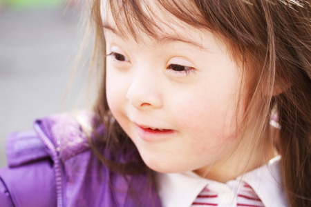 Portrait of beautiful young girl smiling in the parkの写真素材