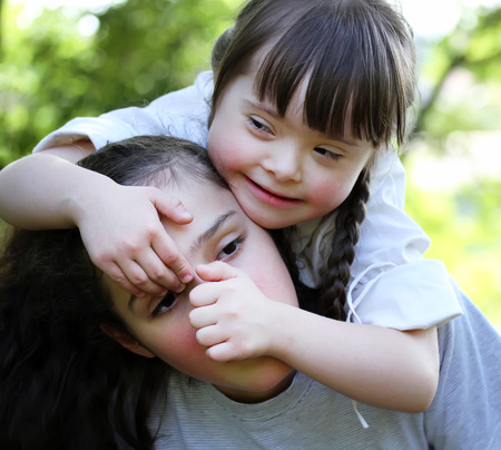 Happy family moments - sisters have a fun.の写真素材