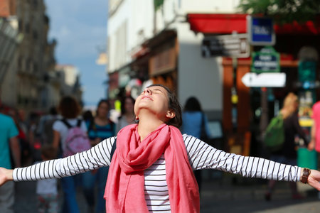 Happy beautiful girl on Montmartre in Paris