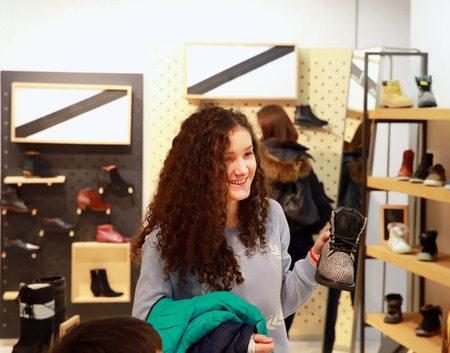 Teenage girl shopping for clothes and accessoriesの写真素材