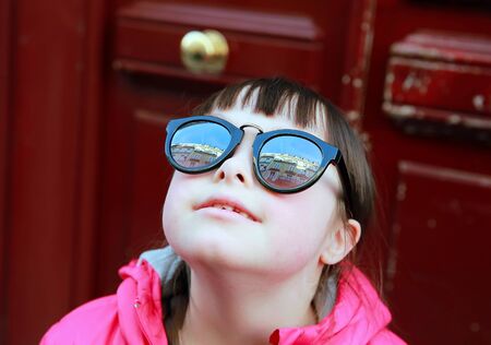 Closeup portrait of girl in sunglasses, outdoorsの写真素材
