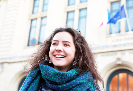 Beautiful student girl on the background of Sorbonne University in Parisの写真素材
