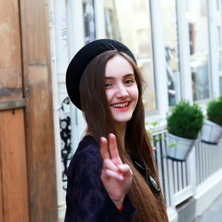 Close-up portrait of beautiful girl in the cityの写真素材