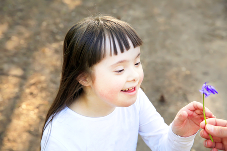 Portrait of beautiful young girl in the parkの写真素材