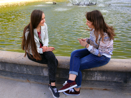 Students girls having fun outsideの写真素材