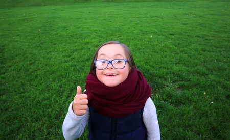 Portrait of beautiful girl with glasses in the park