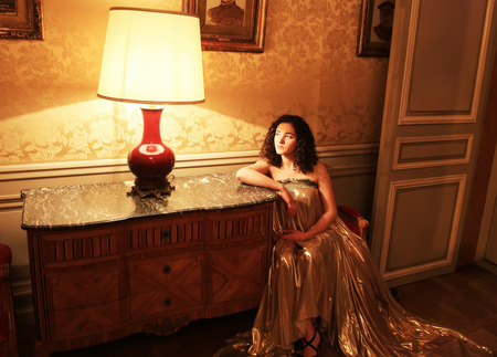 Beautiful lady in the vintage interiorの写真素材