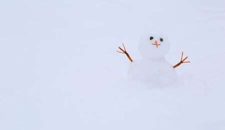 Funny snowman on the snow backgroundの写真素材
