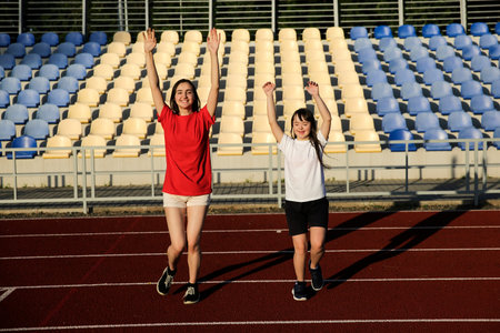 Little girl have fun on the stadium