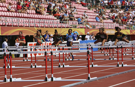 TAMPERE, FINLAND, July 14: Athlets running 100 metres hurdles semi-final in the IAAF World U20 Championship in Tampere, Finland 14 July, 2018.のeditorial素材