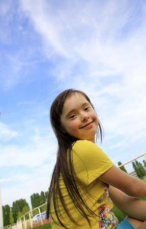 Young girl on the background of the skyの写真素材