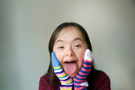 Beautiful girl smiling with different socks