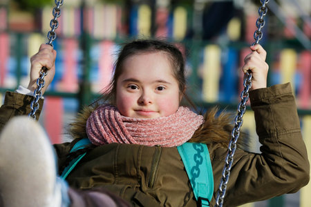 Nice girl having fun on the playground