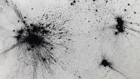 Black blots on a gray background. Abstract background with spotsの写真素材