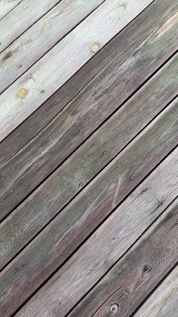 Old gray boards. A panel made of old weathered sedges. Wooden vintage background
