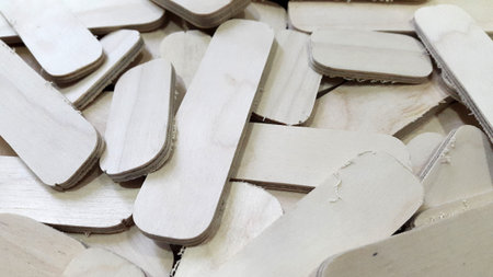 Small scraps of plywood. Background from sawn pieces of plywood