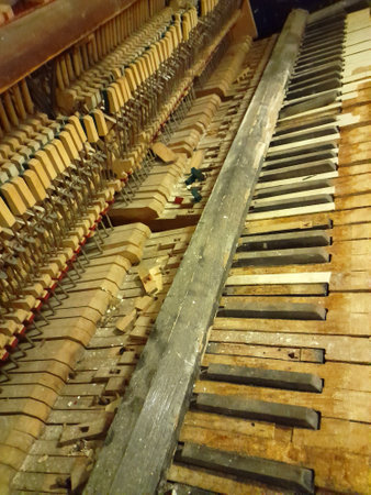 Old broken piano. Vintage background with old piano. broken pianoの写真素材