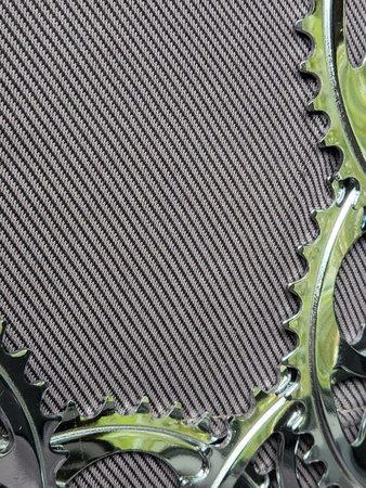 Bicycle sprockets. Bicycle stars on a fabric background. Bicycle parts