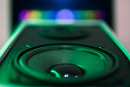 sound speaker in green neon light.Powerful music,blurred backgroundの写真素材