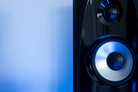 sound speaker with free space on the side on a blue background. High quality photoの写真素材