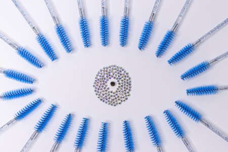 the eye is lined with blue brushes for eyelashes.Materials for eyelashの写真素材