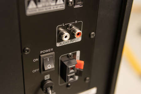 Close-up of the speaker connectors on the back of the AV receiverの写真素材