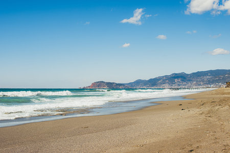 beautiful beach with sea and mountain viewの写真素材