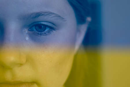 ukrainian baby crying on the right side a place for your inscriptionの写真素材