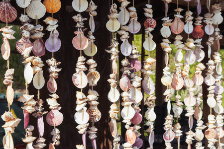 pendants with multi-colored shells are made by hand, they hangの写真素材