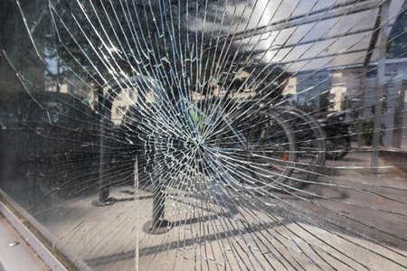 old broken glass in the window, a crack went all over the glass, textureの写真素材