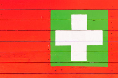 close-up medical care sign Medical care center. Door with a cross. Small medical center for first aid.の写真素材