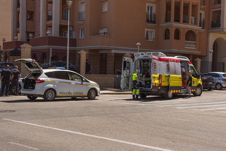 knocked down a man in the city on the road, Spain, Torrevieja on May 28, 2023, an ambulance on the road picks up a person injuredのeditorial素材