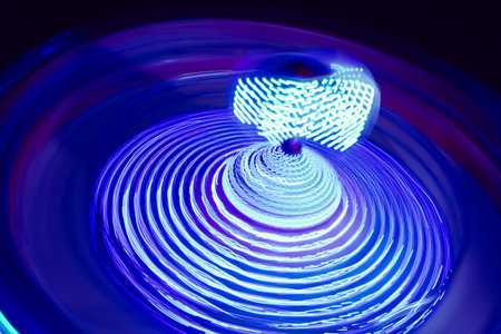 wheel against the background of the black sky in the lunopark close-upの写真素材
