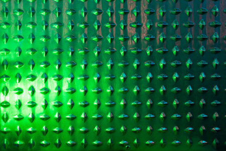 Abstract metal texture with green color closeup, there is a place for an inscriptionの写真素材