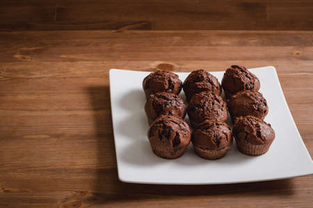 chocolate mafin on a wooden background. quail eggs cinnamon and chocolateの写真素材