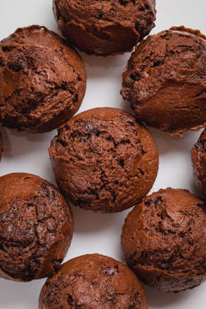 chocolate mafin on a wooden background. quail eggs cinnamon and chocolateの写真素材