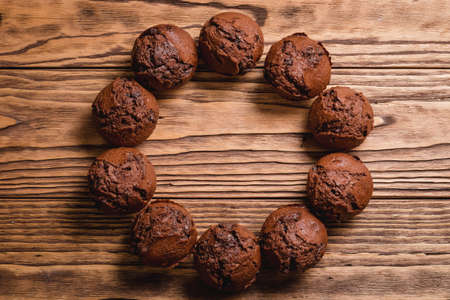 chocolate mafin on a wooden background. quail eggs cinnamon and chocolateの写真素材