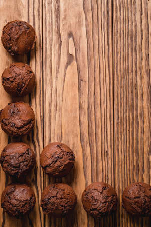 chocolate mafin on a wooden background. quail eggs cinnamon and chocolateの写真素材