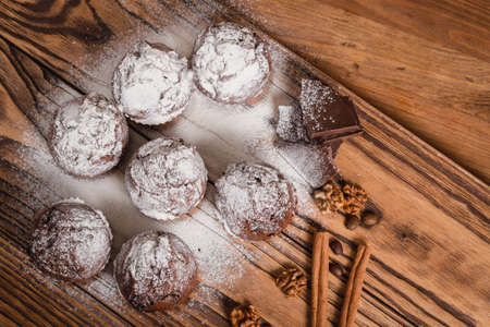 chocolate mafin on a wooden background. quail eggs cinnamon and chocolateの写真素材