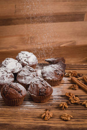 chocolate mafin on a wooden background. quail eggs cinnamon and chocolateの写真素材