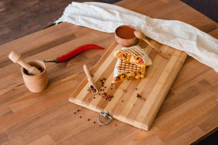 Mexican burrito with chicken , pepper and beans . Mexican food, burrito for breakfast. Top view. Close upの写真素材