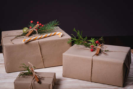 Christmas and New Year holidays. Christmas card with copy space. Stylish branding mockup to display your artworks. Cute vintage christmas new year gifts mock up on wooden background. Close upの写真素材