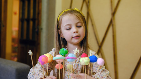 Solar system model toy planets made by kid from colorful molding clay on beige background with blank space for text. DIY activity for children concept.の写真素材