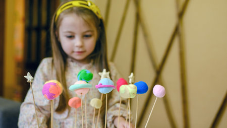 Solar system model toy planets made by kid from colorful molding clay on beige background with blank space for text. DIY activity for children concept.の写真素材