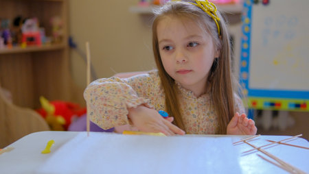 Solar system model toy planets made by kid from colorful molding clay on beige background with blank space for text. DIY activity for children concept.の写真素材