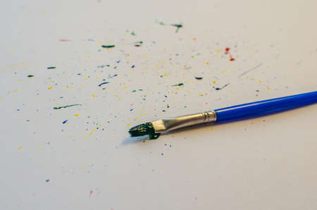 Brushes with colorful paints, isolated on white backgroundの写真素材