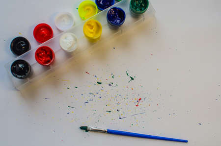 Brushes with colorful paints, isolated on white backgroundの写真素材