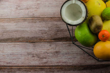 Citrus fruits orange, lemon, grapefruit, mandarin, lime on a wooden backgroundの写真素材