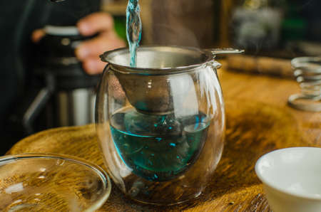 Organic blue tea Anchan in a teapot and a cupsの写真素材