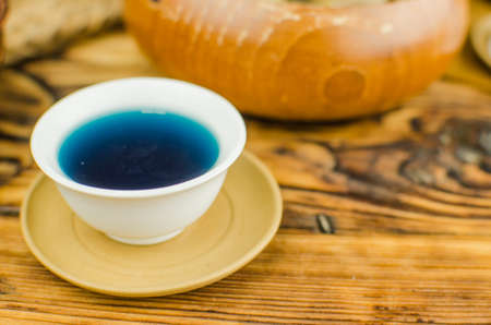 Organic blue tea Anchan in a teapot and a cupsの写真素材
